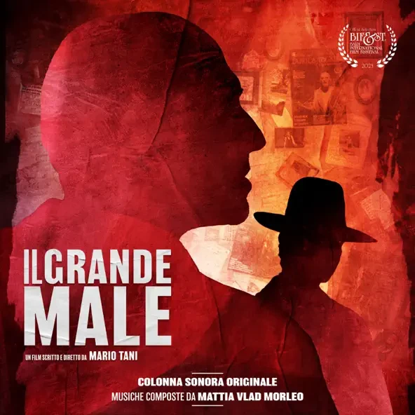 Red-toned poster for "Il Grande Male" with two silhouetted figures, one wearing a hat. Text includes the film's title and credits for director Mario Tani and composer Mattia Vlad Morleo.